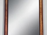 an image of a mirror hanging on a wall in a room