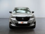 the front view of a silver car in a white room
