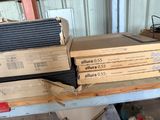 many boxes of air conditioners stacked on a table