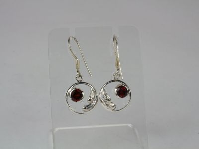 silver plated earrings with garnets and garnets on them