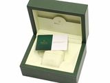 a box with a watch inside of it on a white background