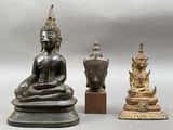 three statues of buddhas sitting next to each other