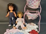 two dolls that are next to each other on a table