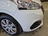 a close up of a car that has been painted white