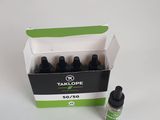 a bottle of cbd oil next to a box of cbd oil