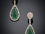 a pair of emerald and diamond earrings