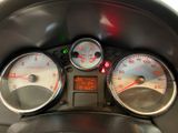a close up of a car dashboard with three gauges