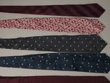several ties laid out in a row on a table