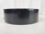 a close up of a black tape on a white surface
