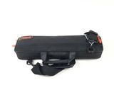 an image of a black case with a red handle on a white background