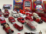 many different types of toy cars and trucks on the table
