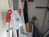 a ladder that is leaning against a wall in a garage