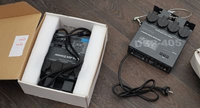 a box that has some electronics in it on the floor