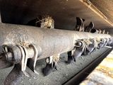 a bunch of pipes that are lined up on the side of a building