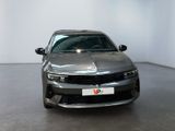 the car is parked in the large room of the showroom