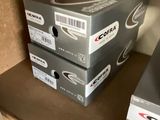 two boxes that are sitting on a shelf next to each other