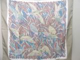 a picture of a wall hanging with a picture of birds on it