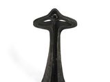 a black sculpture of a cross on a white background