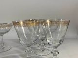 several wine glasses are lined up on a white table