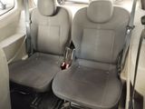 two gray seats in the back of a car