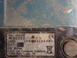 a close up of a blue machine with a number on it