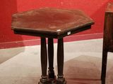 a small table and a small chair in a room