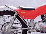 a red motorcycle parked on the side of the road