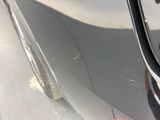 a close up of a car ' s door handle and the door handle of a car