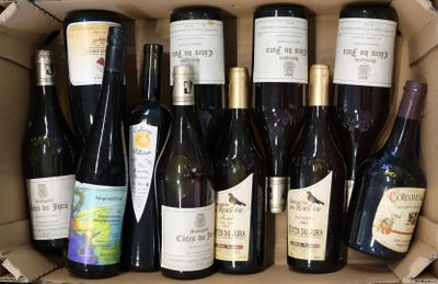 many bottles of wine sitting in a cardboard box