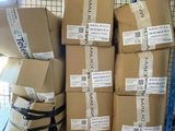 many boxes of luggage on a shelf in a store