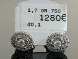 pair of diamond stud earrings with price tag and price tag