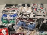 many bags of clothing that are in a box