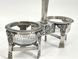 pair of silver plated bowls with spoons on stands