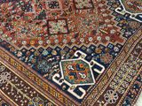 an image of a large oriental rug on a wooden floor