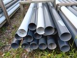 a lot of pipes that are sitting in the grass