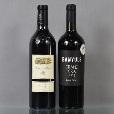 two bottles of wine sitting next to each other on a table