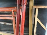 two red pipes that are attached to the side of a building