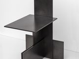 an image of a black table with a drawer underneath it