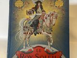 un vieux livre avec l'image d'une femme à cheval
