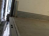 a man that is riding a skateboard in a garage