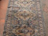an image of a long rug on a floor in a room