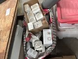 a box full of electrical equipment sitting on the floor