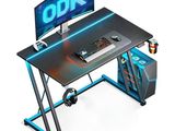 a computer desk with a monitor and keyboard on it