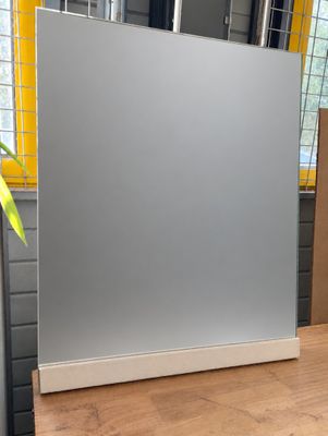 a mirror that is sitting on the floor in front of a window