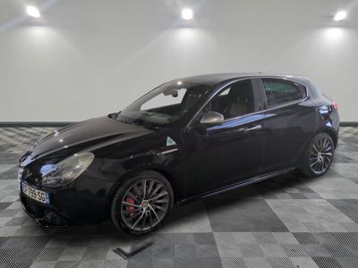 a picture of a black car parked on a checkered floor