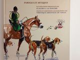 un livre sur lequel figure l'image d'un homme à cheval accompagné de deux chiens