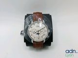 an image of a wrist watch with a brown leather band