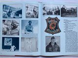 an open book with pictures of military men in it