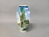 a vase with a painting of a tree on it