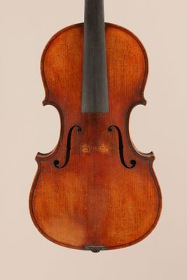 an old violin with a bow hanging from it ' s back